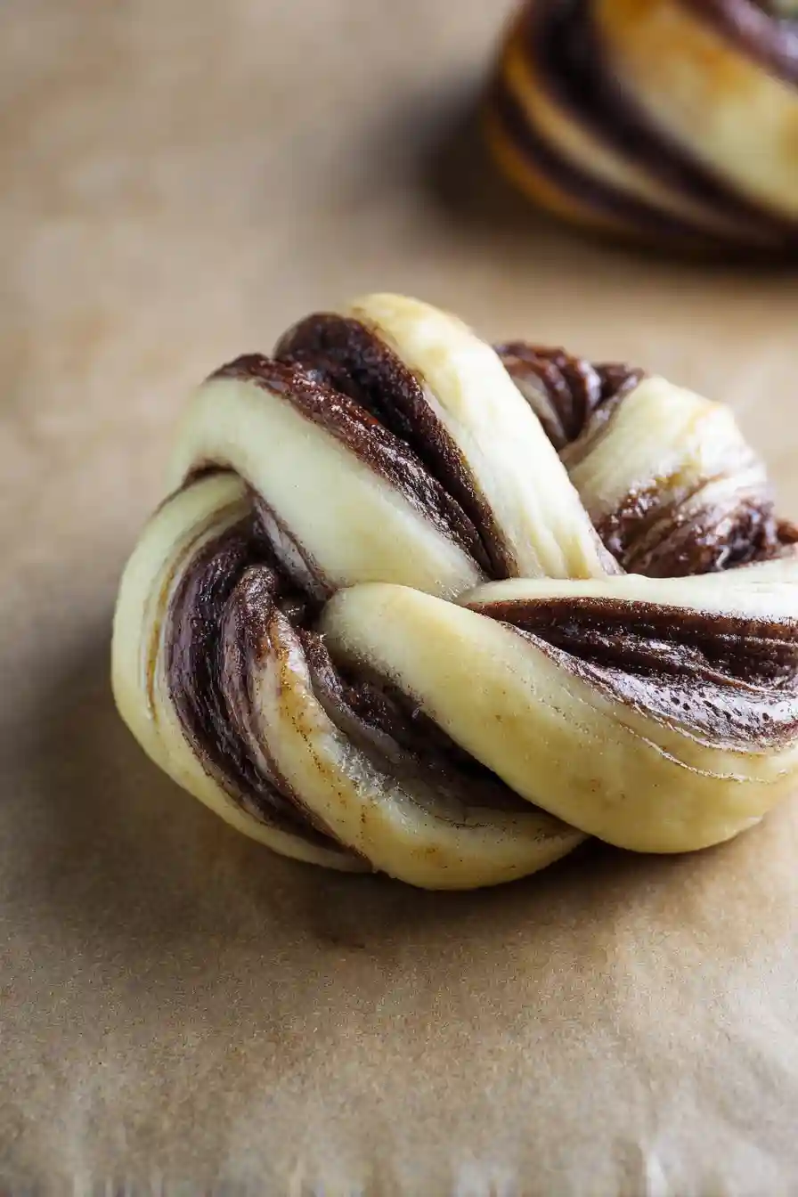 Chocolate-Brioche-2 Braided chocolate brioche dough ready to bake